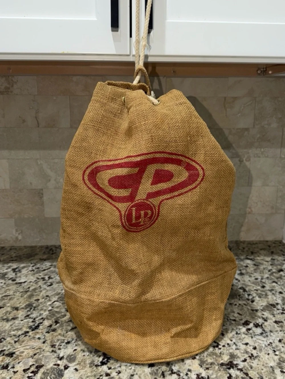 Tan Jute Drawstring Duffel Bag with Red Accent